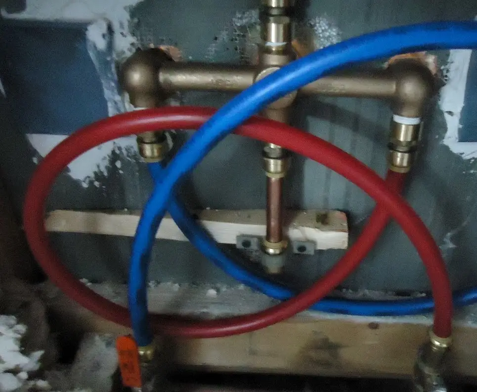 Plumber assembling and fitting water pipes